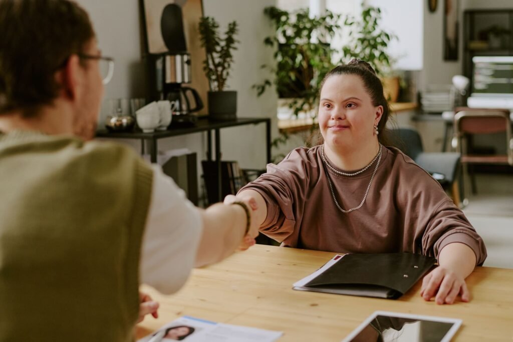 candidate shaking hands with job interviewer