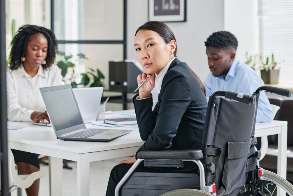 woman with disability sitting at meeting